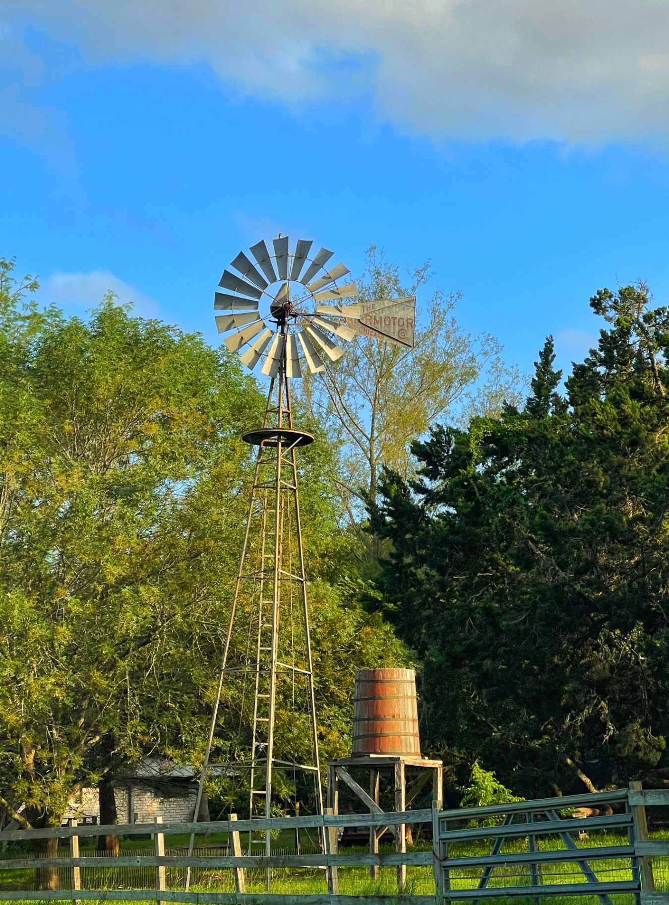 Aermotor windmill blades against a deep blue Texas sky